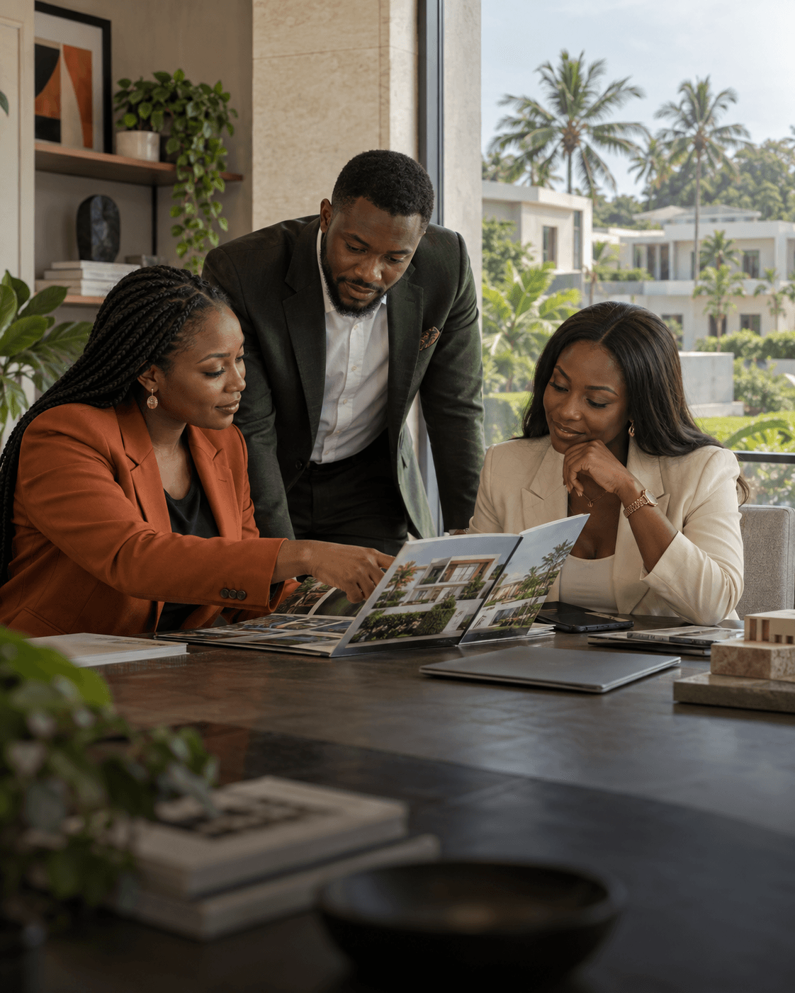 Real estate agency colleagues discussing a property brochure